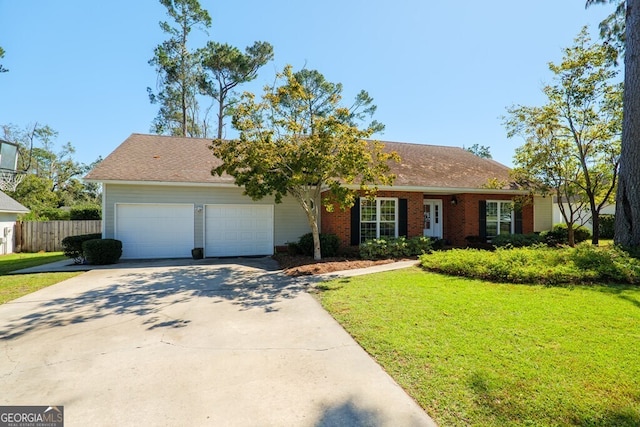 single story home featuring a front lawn and a garage