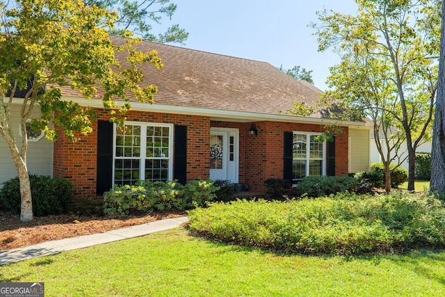 view of front of home with a front lawn