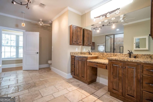 bathroom featuring toilet, ceiling fan, walk in shower, vanity, and crown molding