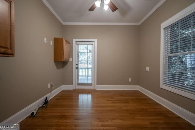 spare room with ceiling fan, crown molding, and hardwood / wood-style floors