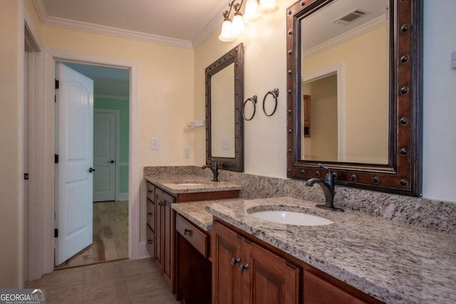 bathroom featuring vanity, ornamental molding, and tile patterned flooring