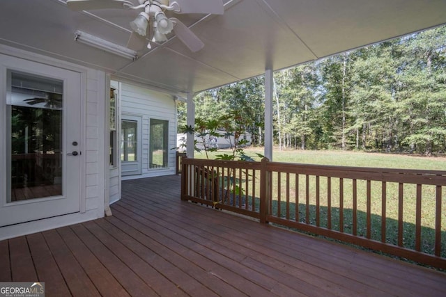 deck featuring a yard and ceiling fan