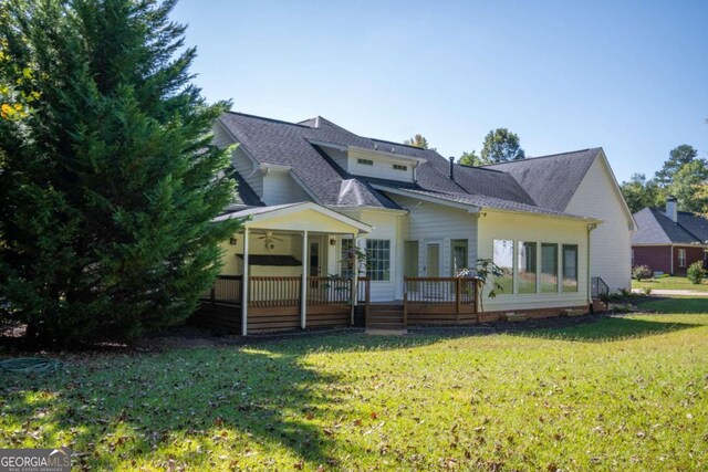 back of house featuring a yard