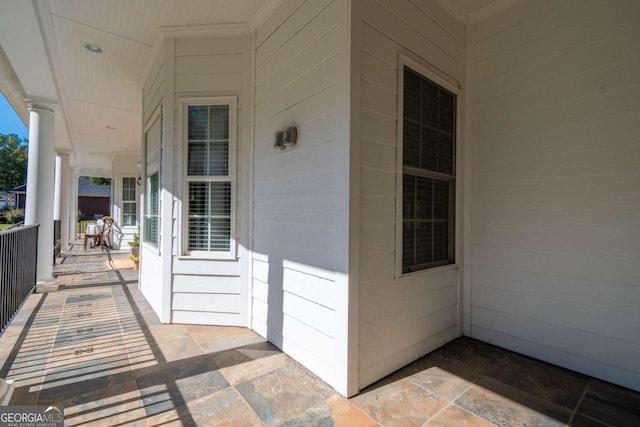 view of exterior entry with covered porch