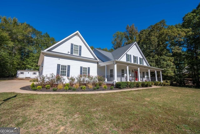 view of front of home with a porch and a front yard