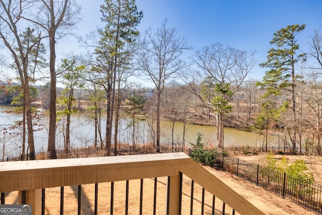 view of water feature with fence