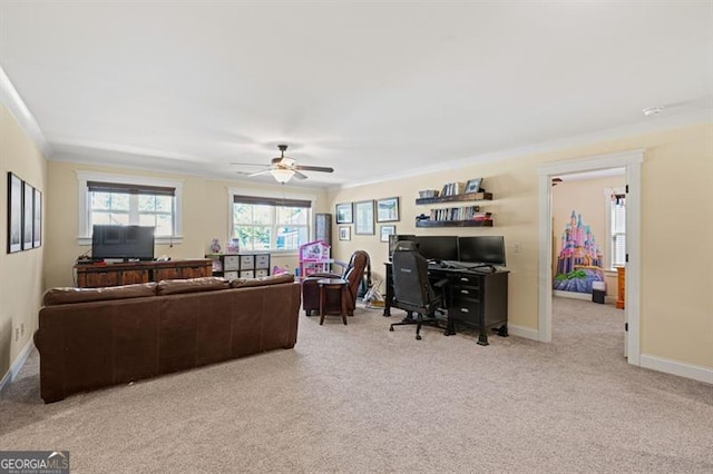 living room featuring light carpet, ceiling fan, ornamental molding, and baseboards