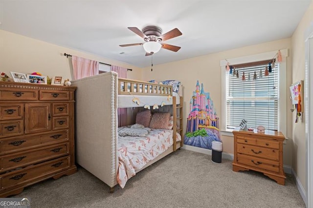 bedroom with light carpet, ceiling fan, and baseboards