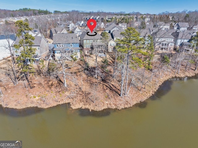 bird's eye view with a water view and a residential view