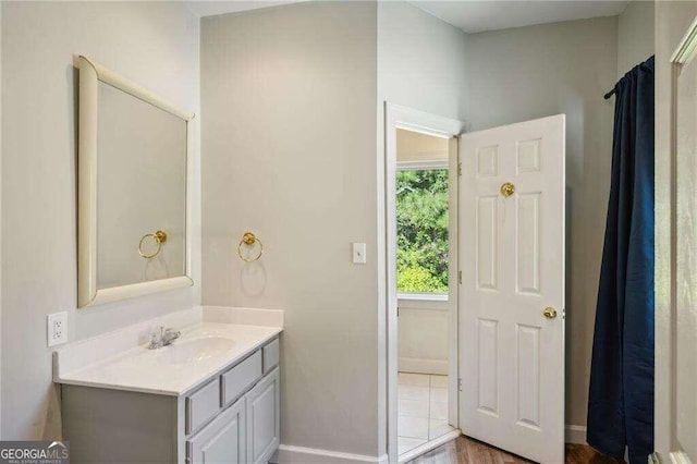 bathroom with vanity and wood-type flooring