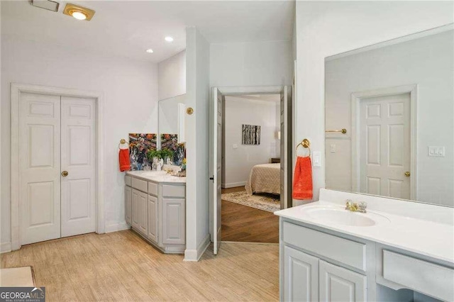 bathroom featuring vanity and hardwood / wood-style flooring