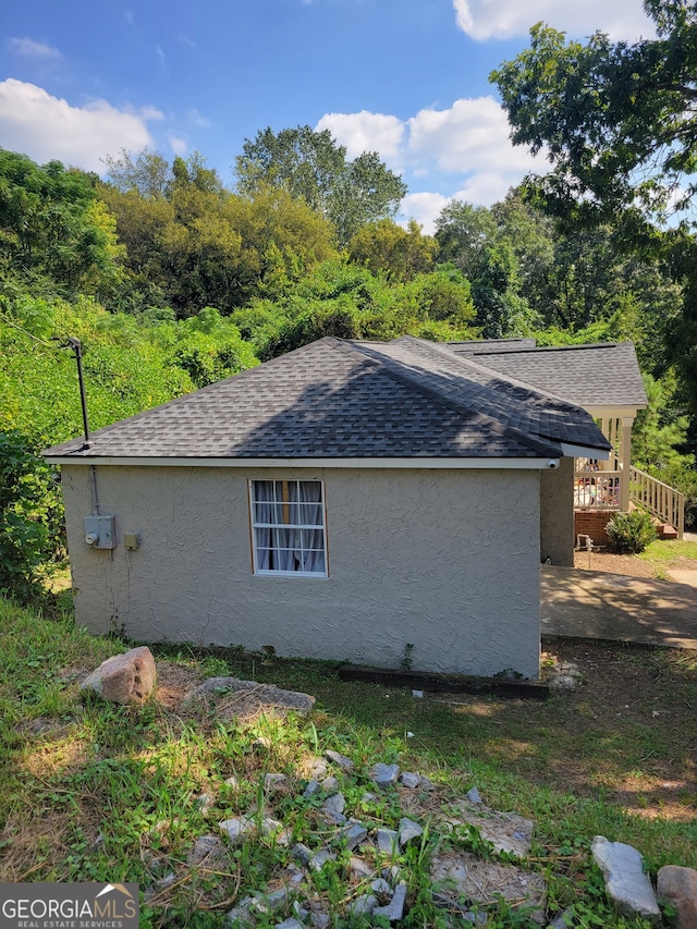 view of home's exterior featuring a deck