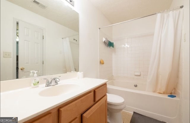 full bathroom with vanity, toilet, tile patterned floors, and shower / bath combo