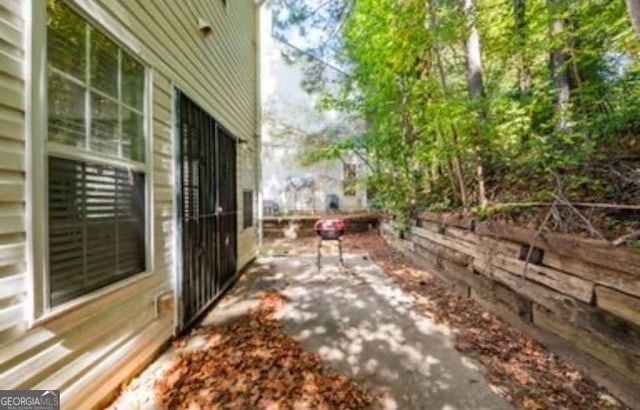 view of property exterior with a patio