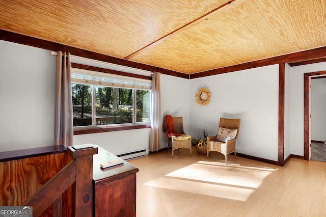 sitting room featuring wooden ceiling, baseboard heating, and light wood-type flooring