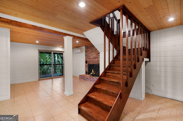 stairs with wood ceiling, wooden walls, a wall mounted air conditioner, and a fireplace