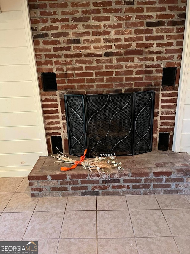 room details with wooden walls and a fireplace