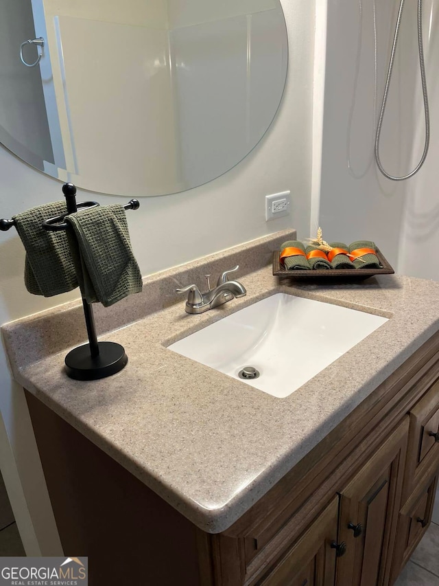 bathroom with vanity and tile patterned flooring