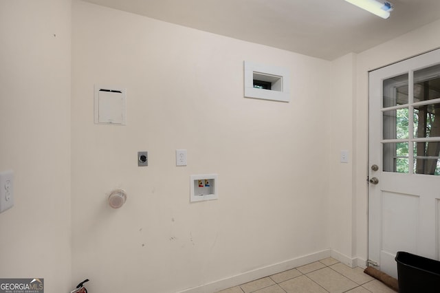 laundry area featuring hookup for an electric dryer, hookup for a washing machine, and light tile patterned floors