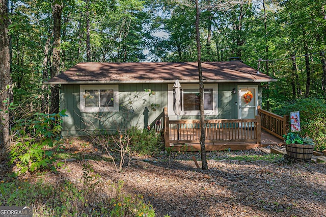 single story home with a wooden deck