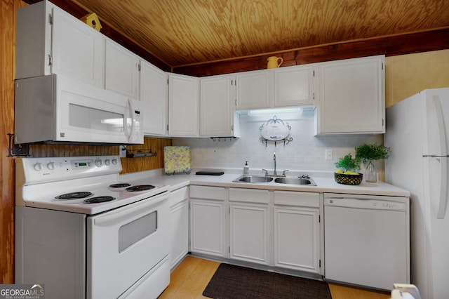 kitchen with sink, white cabinets, white appliances, and light hardwood / wood-style floors