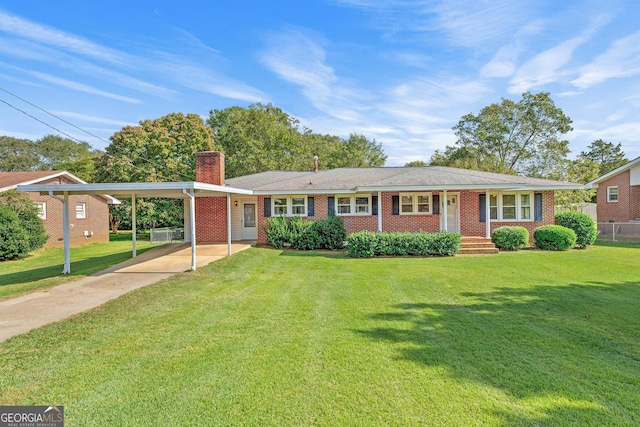 ranch-style home featuring a front lawn and a carport