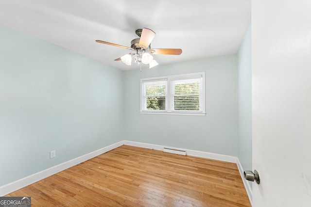 spare room featuring light wood-type flooring and ceiling fan