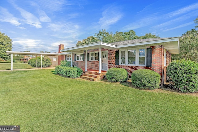 ranch-style house featuring a porch and a front lawn