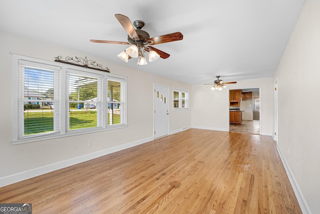 unfurnished living room with light hardwood / wood-style floors and ceiling fan