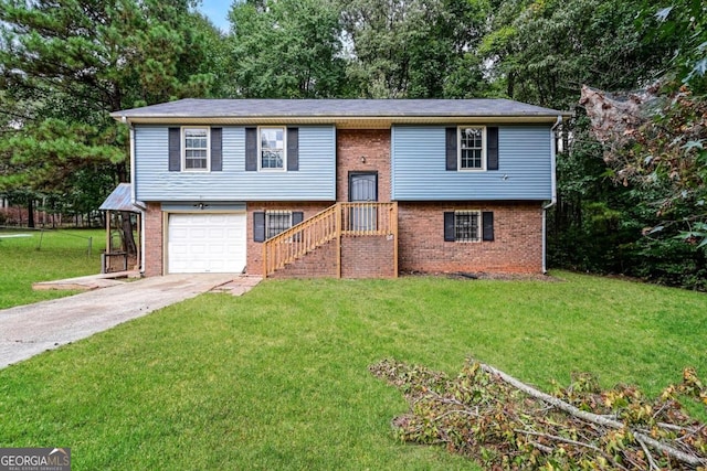 split foyer home featuring a front yard and a garage