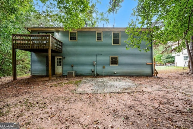 back of house with a wooden deck