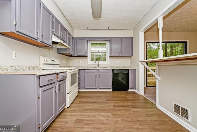 kitchen featuring a textured ceiling, white electric range, light hardwood / wood-style flooring, dishwasher, and gray cabinetry