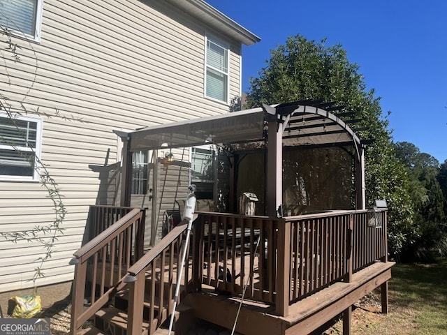 wooden terrace featuring a pergola