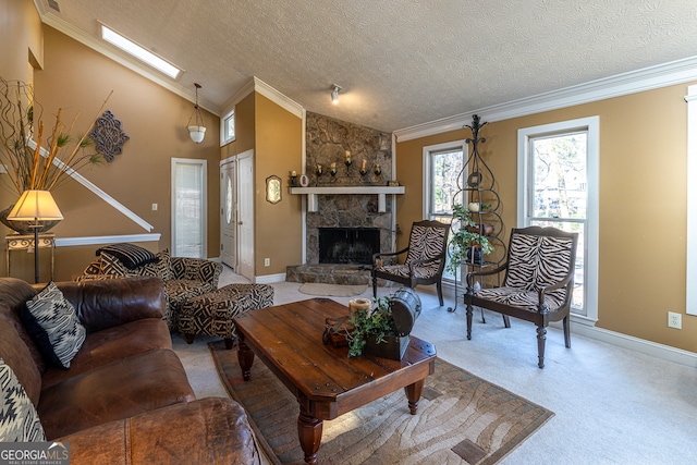 living room with carpet, crown molding, a skylight, a textured ceiling, and a fireplace