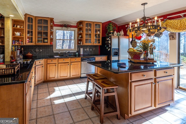 dining room with a textured ceiling, washer / clothes dryer, and light parquet floors