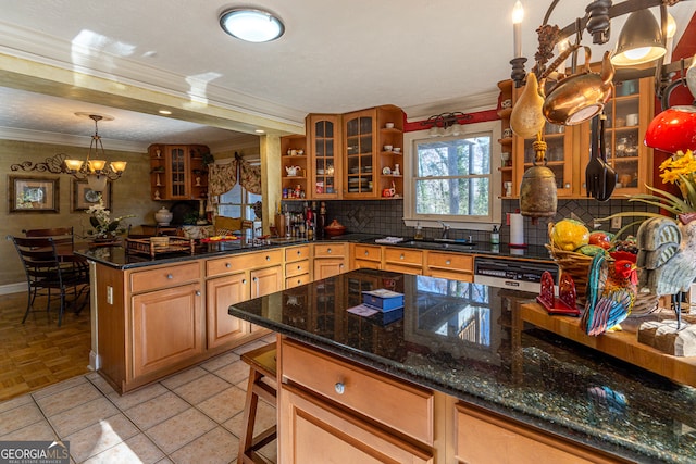 kitchen featuring a center island, hanging light fixtures, tasteful backsplash, stainless steel fridge with ice dispenser, and dark stone counters