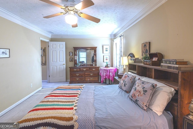 carpeted bedroom with ceiling fan, crown molding, and a textured ceiling