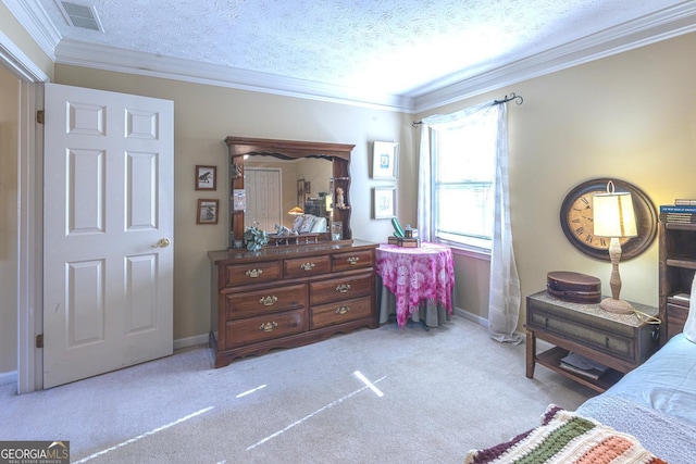 bedroom featuring a textured ceiling, light colored carpet, ceiling fan, and ornamental molding