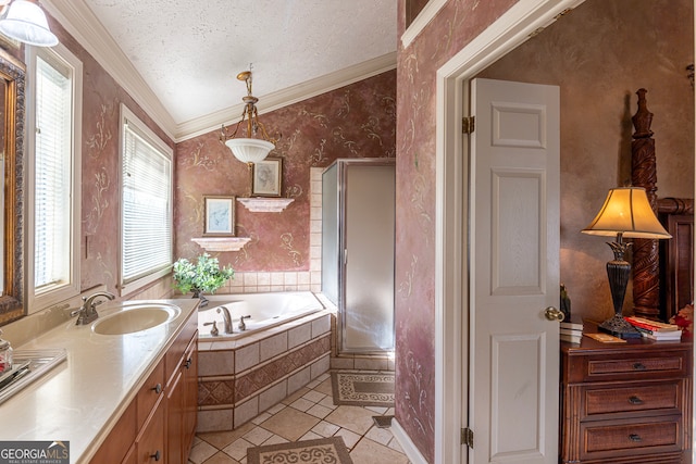 bathroom featuring vanity, vaulted ceiling, tile patterned flooring, a textured ceiling, and tiled tub