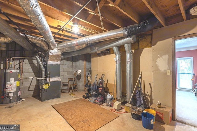 basement featuring heating unit and water heater