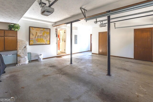 garage featuring electric panel and a garage door opener