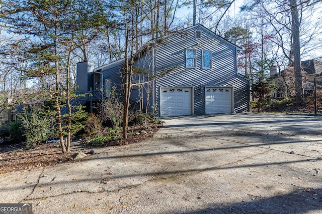 view of property exterior featuring a garage