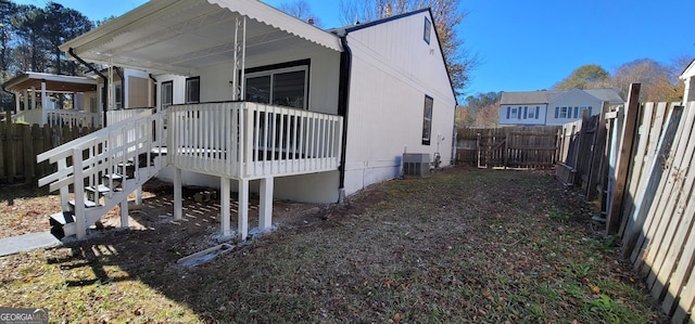 view of side of property featuring central air condition unit