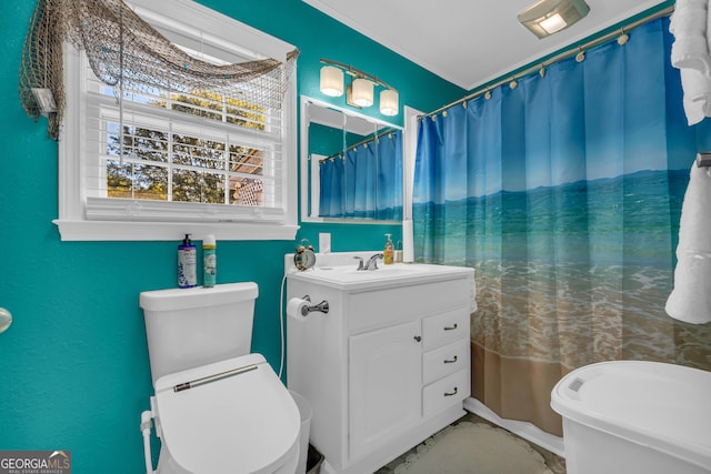 bathroom featuring toilet and vanity