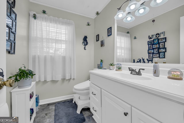 bathroom featuring toilet, ornamental molding, and vanity