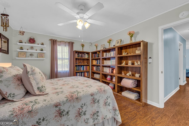 bedroom featuring ornamental molding, hardwood / wood-style floors, and ceiling fan