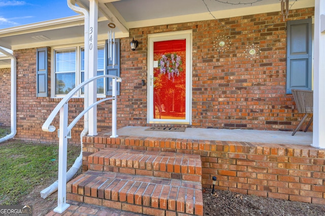 property entrance featuring a porch