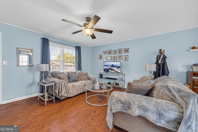 living room featuring hardwood / wood-style flooring and ceiling fan