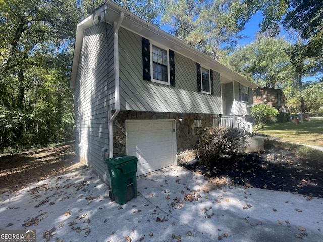 view of side of property featuring a garage