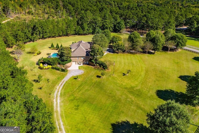 birds eye view of property with a rural view